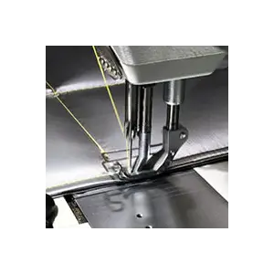 Sewing machine for technical-use textiles manufacturing.